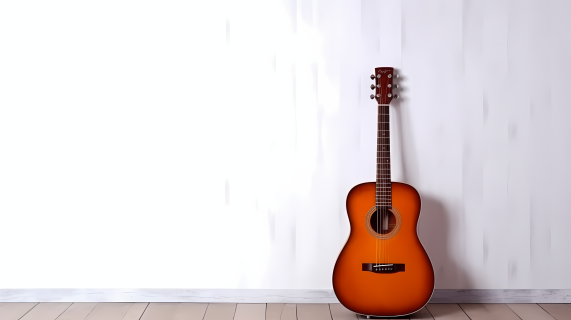 橙色木吉他倚靠白色极简背景摄影图