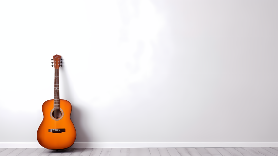 橘色木吉他竖立在极简白色房间摄影图片