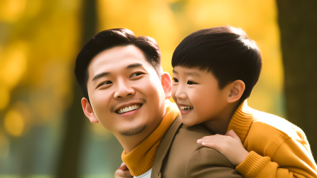 年轻父亲和儿子的幸福摄影图