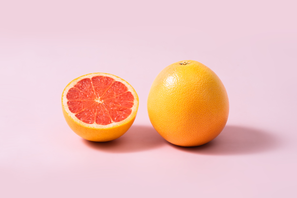 粉色背景黄色血橙高清图版权图片下载