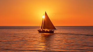 坦桑尼亚落日中飘荡的帆船摄影图