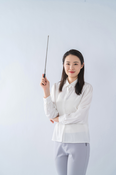 手拿教杆的女老师图版权图片下载
