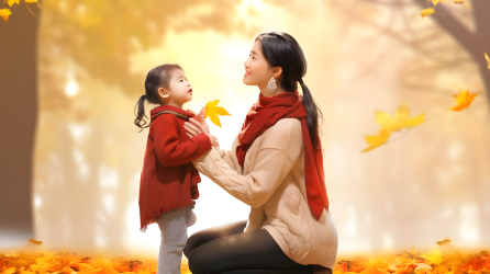 秋景中母亲喂围巾抱着小女孩摄影图片