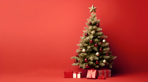 红色背景下的圣诞树礼物摄影图片